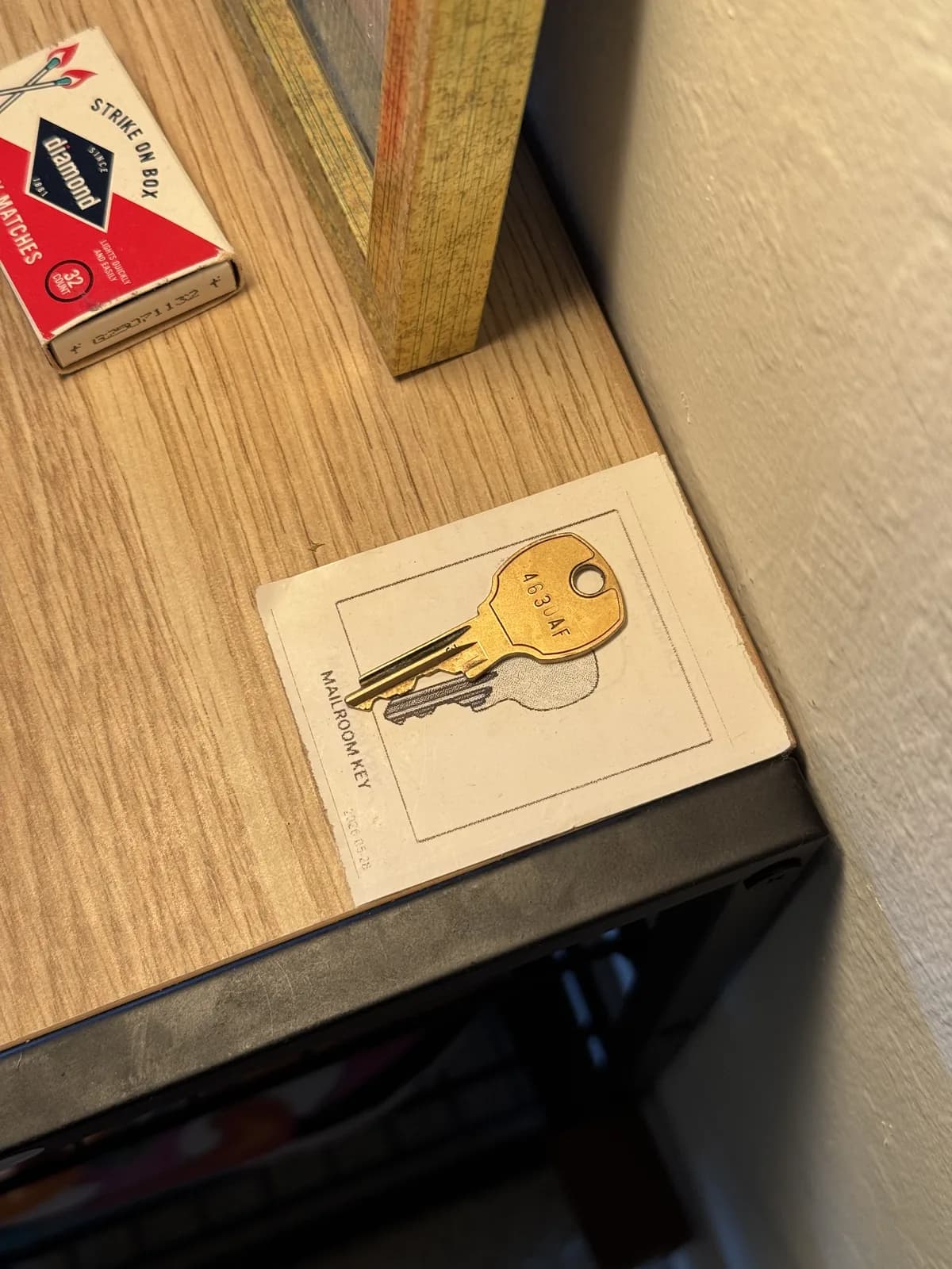 Mailroom key organizer labeled with a picture of its keys